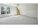 Spacious bedroom with neutral carpet, window, and built-in shelving at 1059 Hedge Rose Ne Ct, Atlanta, GA 30324