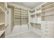 Large walk-in closet with custom organizers and built-in drawers at 1059 Hedge Rose Ne Ct, Atlanta, GA 30324