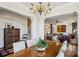 Open-concept view from dining area to living room with staircase and hardwood floors at 1059 Hedge Rose Ne Ct, Atlanta, GA 30324