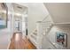 Hallway with wood and carpet flooring and white trim at 1059 Hedge Rose Ne Ct, Atlanta, GA 30324