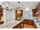 Gourmet kitchen with custom wood cabinets, granite countertops, and stainless steel appliances at 1059 Hedge Rose Ne Ct, Atlanta, GA 30324