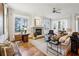 Bright living room with fireplace, hardwood floors, and view to the dining area at 1059 Hedge Rose Ne Ct, Atlanta, GA 30324