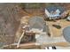 Aerial view of the property showcasing the backyard, deck, well-maintained lawn, and wooded surroundings at 1554 Sage Ridge Dr, Marietta, GA 30064