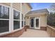 Back porch with neutral siding, windows, and a door with access to the backyard at 1554 Sage Ridge Dr, Marietta, GA 30064