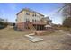 Spacious backyard featuring a multi-tiered deck, steps to the lawn, walkway, and lush landscaping at 1554 Sage Ridge Dr, Marietta, GA 30064