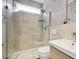 Contemporary bathroom with a glass-enclosed shower, modern fixtures, and neutral tile at 1554 Sage Ridge Dr, Marietta, GA 30064