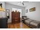 Cozy bedroom featuring hardwood floors, a comfortable bed, and natural light from the window at 1554 Sage Ridge Dr, Marietta, GA 30064