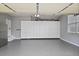 Spacious garage with ample storage cabinets, epoxy floor, and room for vehicles and storage at 1554 Sage Ridge Dr, Marietta, GA 30064