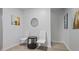 Hallway with white chairs, small table and neutral wall colors with artwork at 1554 Sage Ridge Dr, Marietta, GA 30064