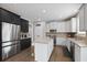 Modern kitchen featuring stainless steel appliances, granite countertops, and a mix of white and black cabinetry at 1554 Sage Ridge Dr, Marietta, GA 30064