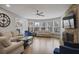 Spacious living room filled with natural light, a stone fireplace, and modern furnishings at 1554 Sage Ridge Dr, Marietta, GA 30064