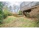 Backyard featuring a wooden fence, a patio deck with stairs, and a circular garden space at 2426 Vivian Cir, Decatur, GA 30030