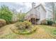 Backyard featuring a wooden fence, a patio deck with stairs, and a circular garden space at 2426 Vivian Cir, Decatur, GA 30030