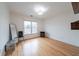 Bedroom with hardwood floors and ample natural light streaming through a large window at 2426 Vivian Cir, Decatur, GA 30030