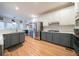 Spacious kitchen with two-tone cabinets, stainless steel appliances, hardwood floors, and a subway tile backsplash at 2426 Vivian Cir, Decatur, GA 30030