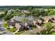 An aerial perspective of homes surrounding a central pond, set in a well-planned community at 352 Lauren Ln, Woodstock, GA 30188