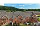 An aerial view highlighting the homes' back patios and decks overlooking the landscaped surroundings at 352 Lauren Ln, Woodstock, GA 30188