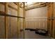 Unfinished basement with concrete walls and framing, and some storage items at 352 Lauren Ln, Woodstock, GA 30188