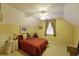 Comfortable bedroom showcasing a bed with decorative pillows and a ceiling fan for a relaxing atmosphere at 352 Lauren Ln, Woodstock, GA 30188