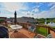 Backyard deck with a table, chairs, and a view of the lake at 352 Lauren Ln, Woodstock, GA 30188