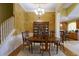 Elegant dining room with a large table and chairs, chandelier, and access to the kitchen at 352 Lauren Ln, Woodstock, GA 30188