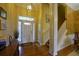 Elegant foyer with hardwood floors, staircase, and a well-lit entryway at 352 Lauren Ln, Woodstock, GA 30188