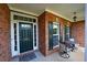 Inviting front porch with seating area, perfect for relaxing and enjoying the outdoors at 352 Lauren Ln, Woodstock, GA 30188