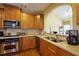 Beautiful kitchen with wooden cabinets, stainless steel appliances, and granite countertops at 352 Lauren Ln, Woodstock, GA 30188