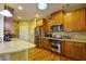 Bright kitchen features stainless steel appliances, a kitchen island, and abundant cabinet space at 352 Lauren Ln, Woodstock, GA 30188