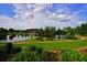 Manicured landscaping with walking paths around a community lake, creating a peaceful and inviting atmosphere at 352 Lauren Ln, Woodstock, GA 30188