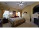 Cozy main bedroom with large windows, vaulted ceiling, and fireplace at 352 Lauren Ln, Woodstock, GA 30188