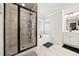 Well-lit bathroom featuring a glass shower and a soaking tub next to a window at 3865 Brookhollow Dr, Douglasville, GA 30135