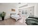 Bedroom with natural lighting, a tray ceiling, and neutral-colored carpeting at 3865 Brookhollow Dr, Douglasville, GA 30135