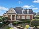 A beautiful brick clubhouse features manicured landscaping, a ramp for accessibility, and large windows at 3865 Brookhollow Dr, Douglasville, GA 30135