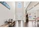 Grand foyer with high ceilings, dark hardwood floors, and abundant natural light from the arched window at 3865 Brookhollow Dr, Douglasville, GA 30135