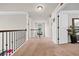 Upstairs hallway with carpeted floors leading to bedrooms at 3865 Brookhollow Dr, Douglasville, GA 30135