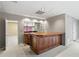 Basement bar that includes a sink, bar top, wine rack and mirror at 398 Picketts Xing, Acworth, GA 30101