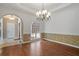 Elegant dining room with hardwood floors and decorative molding for memorable gatherings at 398 Picketts Xing, Acworth, GA 30101