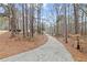 Long winding driveway leads to a home nestled in a wooded lot offering privacy and seclusion at 398 Picketts Xing, Acworth, GA 30101