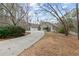 Attractive single-story home with a circular driveway, three-car garage and mature landscaping at 398 Picketts Xing, Acworth, GA 30101