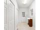 Hallway with multiple closets, tile flooring, and a small vanity with sink at 398 Picketts Xing, Acworth, GA 30101