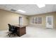 Bright office space featuring a desk, neutral walls, and a large window at 398 Picketts Xing, Acworth, GA 30101