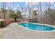 In-ground pool with gazebo, lush landscaping, and concrete surround; great for entertaining at 398 Picketts Xing, Acworth, GA 30101