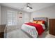 Comfortable bedroom showcases a ceiling fan, a large bed and lots of natural light at 4037 Mcpherson Dr, Acworth, GA 30101