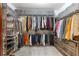 Walk-in closet provides ample storage space with shelving, drawers, and hanging rods at 4037 Mcpherson Dr, Acworth, GA 30101