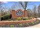 Community sign surrounded by manicured landscaping and brick features at 4037 Mcpherson Dr, Acworth, GA 30101