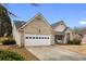 Beautiful home boasts a well-manicured lawn and inviting front porch with swing at 4037 Mcpherson Dr, Acworth, GA 30101