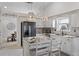 Bright eat-in kitchen featuring a granite island, white cabinetry, and pendant lighting at 4037 Mcpherson Dr, Acworth, GA 30101