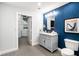 Stylish bathroom showcasing vanity with marble countertop and modern fixtures with laundry room in background at 115 W Peachtree Nw # 405, Atlanta, GA 30313