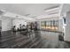 Spacious gym area with plenty of workout equipment and a big window for natural lighting at 115 W Peachtree Nw # 405, Atlanta, GA 30313